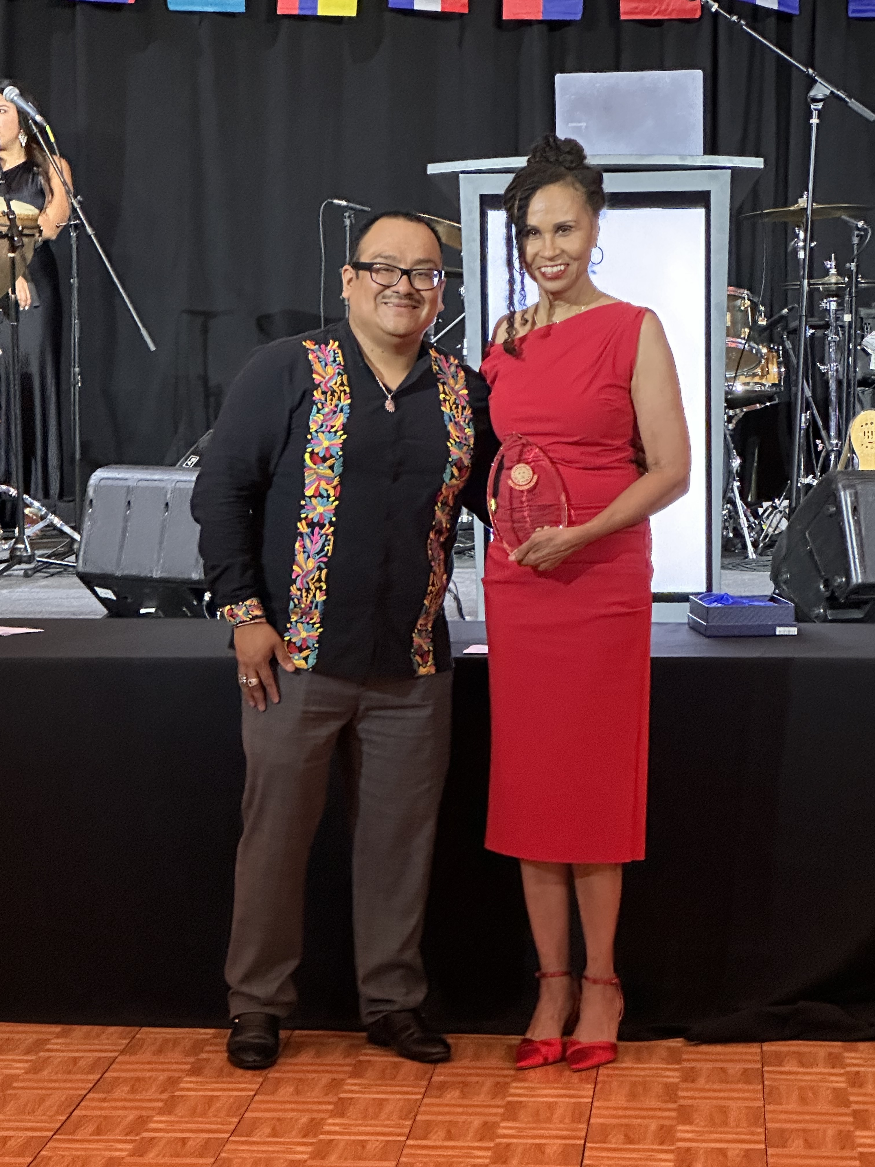 Cheryl Dickson, MD, MPH, accepts the Warrior Hero Award from El Concilio CEO Adrian Vazquez