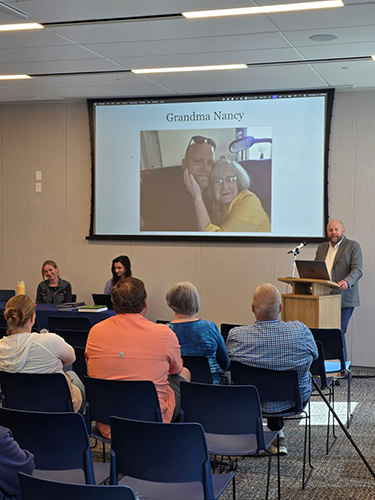 Tyler Gibb, JD, PhD, co-chair of the Department of Medical Ethics, Humanities, and Law, speaks May 16, 2026, during the team's presentation of “Inked by Faith: Blood-Type Tattoos, Cold War Preparedness, and Community Memory in Cache Valley in the early 1950s” as part of an America 250 Lecture Series at the Logan Library in Logan, Utah