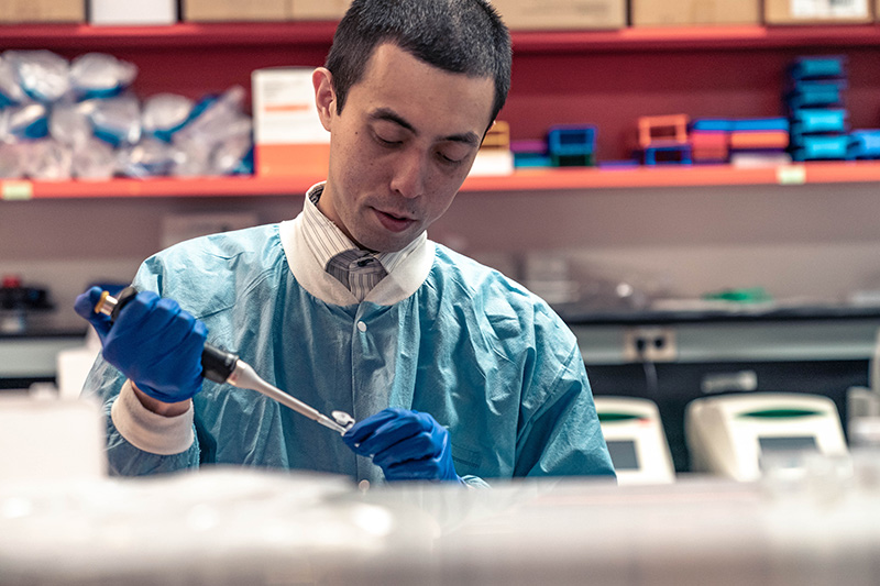 Hiroyuki Hirakawa, MD, PhD, works with samples in his lab